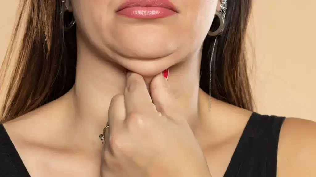 An image of a woman with double chin, sad, worried : Non Surgical Double Chin Removal Treatment in Milngavie, UK